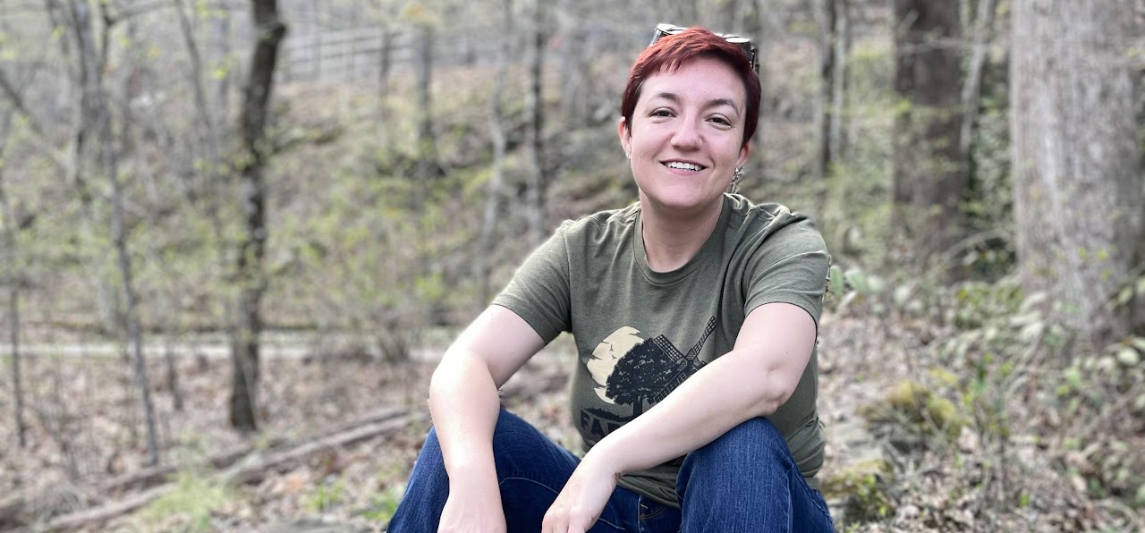 Hannah of HillBetty sitting in the North Georgia woods